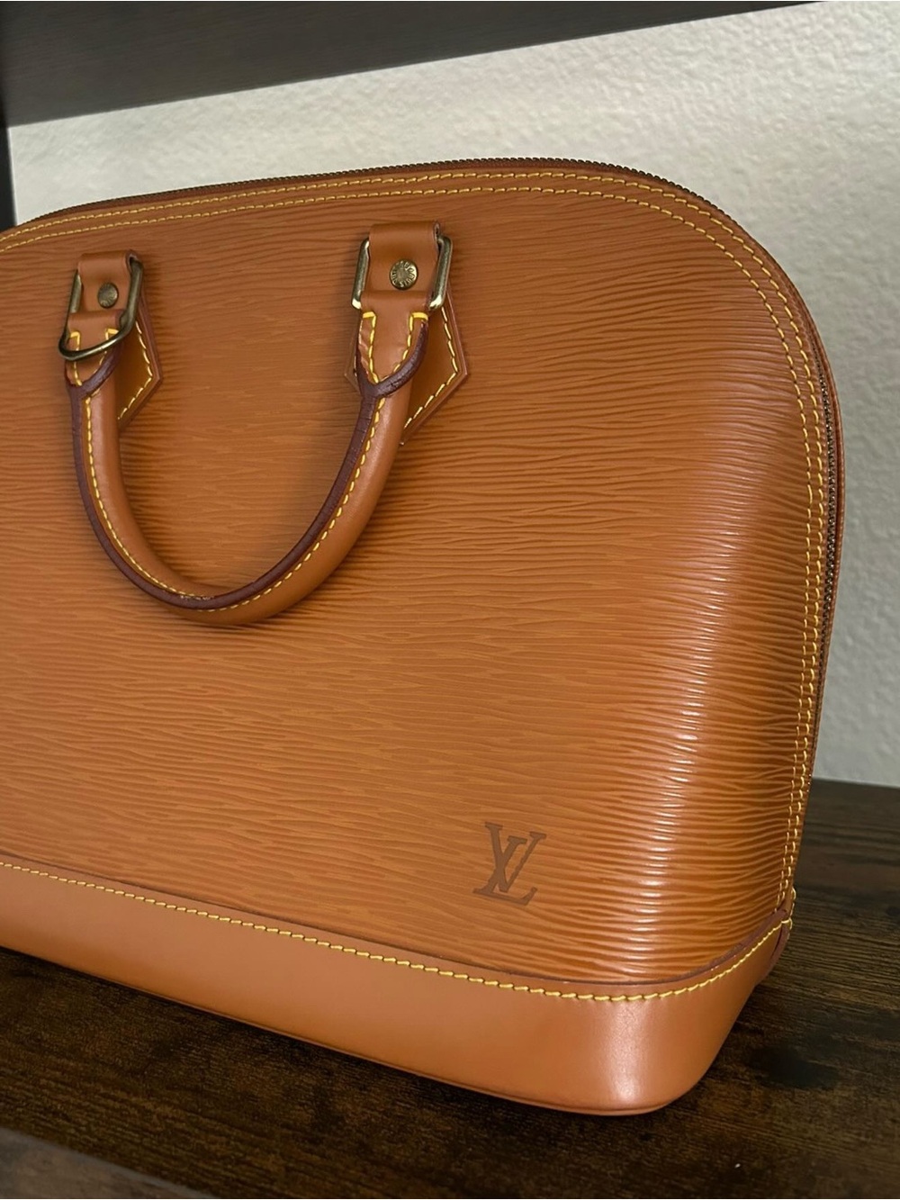 Louis Vuitton Epi Alma Handbag in Cognac